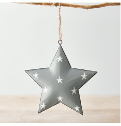 A grey toned metal hanging star with an overly distressed design and added white starry print to finish 