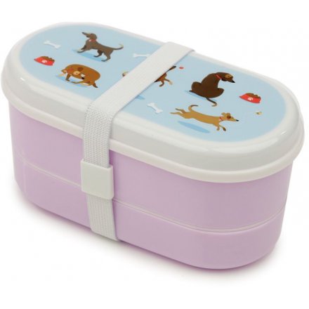 a purple toned bento box with added matching cutlery and a quirky dog print 