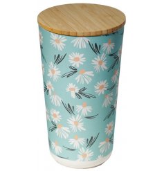  A stylish storage solution for any kitchen space, a sturdy bamboo based container with a wood lid and cute daisy decal 