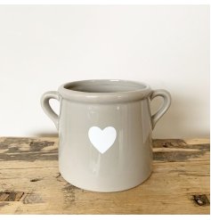 A Rustic Pot In Grey With Heart Design