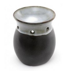 A stylish black and smoked grey tlight holder complete with a dipped dish for oil/wax melting 