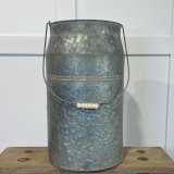 A Charming Metal Churn with Distressed Look