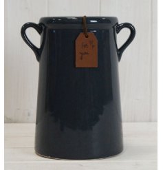  A deep navy hued ceramic vase featuring tapered ear handles and a leatherette tag to finish 
