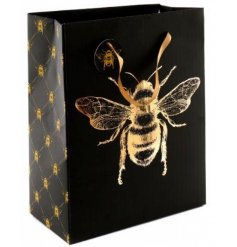  A large gift bag with black and gold tones, decorated with a luxe Bee central decal 