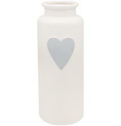 A large grey vase with heart decal