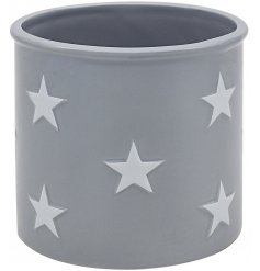 A large grey planter with star decals