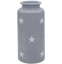 A small grey vase with star decals 