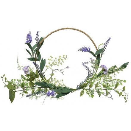 A delicate artificial lavender wreath with pretty purple petals and entwining vines 