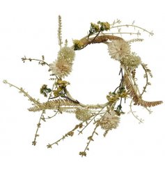A rustic wreath with pretty dried flowers and leaves. 