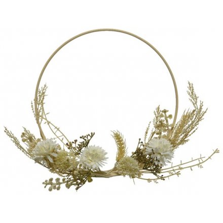 An elegant loop wreath dressed with an abundance of bohemian artificial blooms and leaves.
