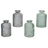 An assortment of 4 blue and green coloured glass bottles, each with a decorative textured surface. 