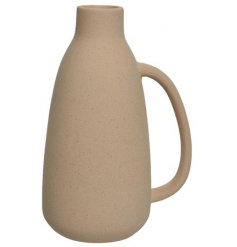 A classic and chic natural ceramic vase with curved handle and speckled finish. From our popular simple living range.