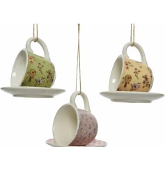 An assortment of 3 pretty floral tea cup and saucer bird feeders. 