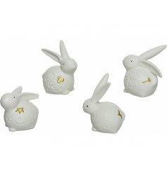 An assortment of 4 beautiful porcelain bunny decorations. Each has a delicate floral engraving and unique gold detail.