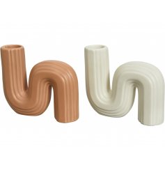 An assortment of 2 ceramic curve vases. Each is sculptural in design with embossing and a matte finish.