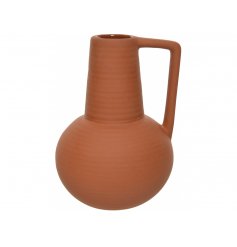 A stylish terracotta coloured vase. A must have item this season. 