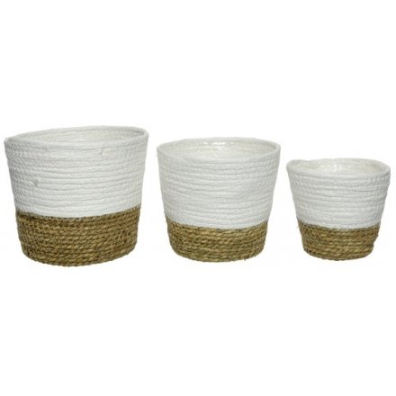 A set of 3 round natural grass baskets.