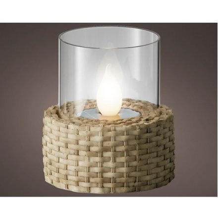A solar powered flickering flame encased in glass and wrapped in a wicker base.
