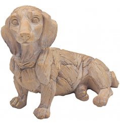 Sure to add a hint of rustic charm to any home space, a delightful little dog ornament set with a driftwood inspired dec