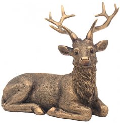 Compliment rustic country home interiors with this bronzed deer resin ornament. 