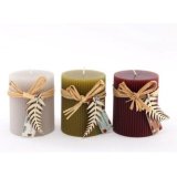 An Assortment of Three Ribbed Pillar Candles, in Maroon Red and Burnt Orange