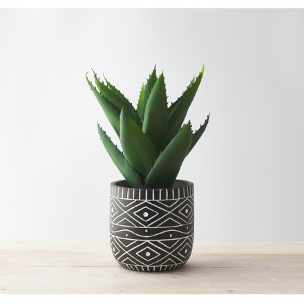A Unique Planter Pot with Black Background and White Aztec Design
