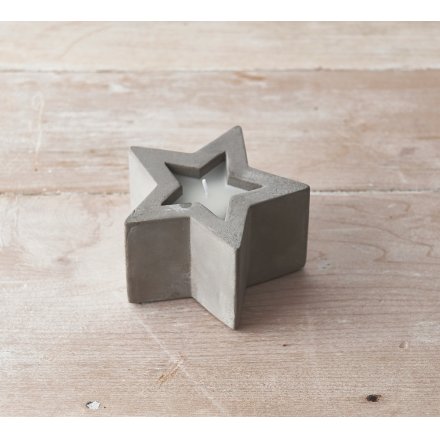 A Simplistic Concrete Candle in a Star Cut Out Design
