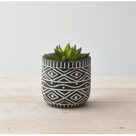 A Quirky Planter Pot with White Aztec Design