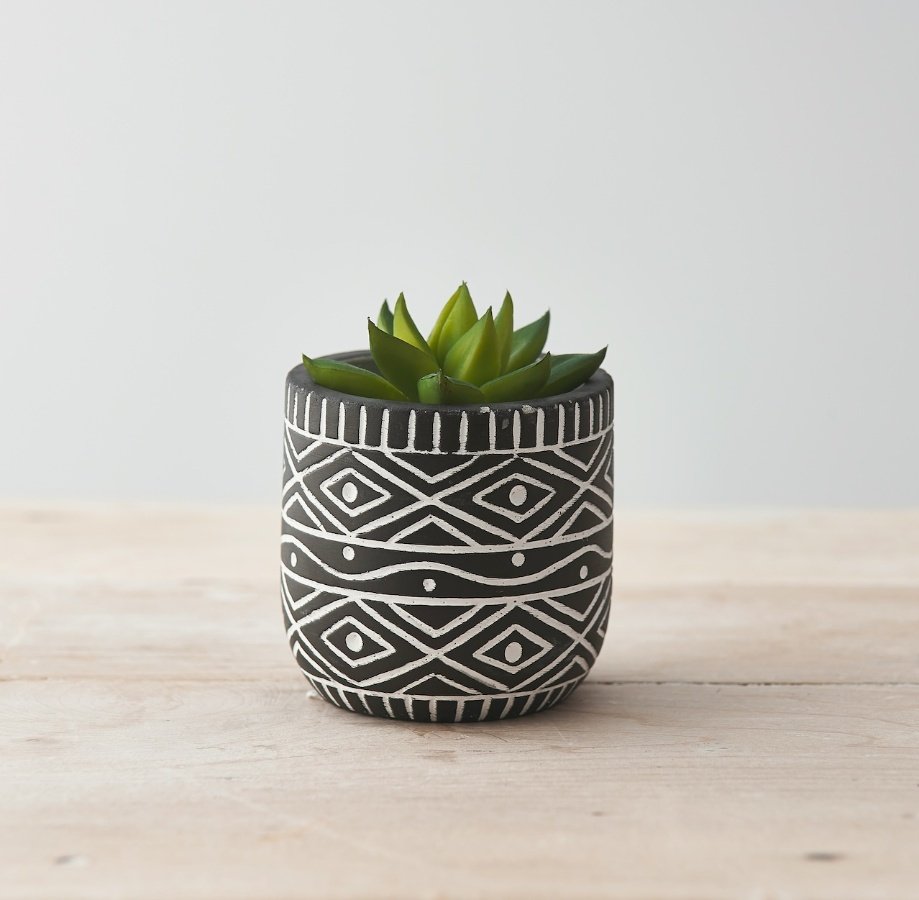 A Quirky Planter Pot with White Aztec Design