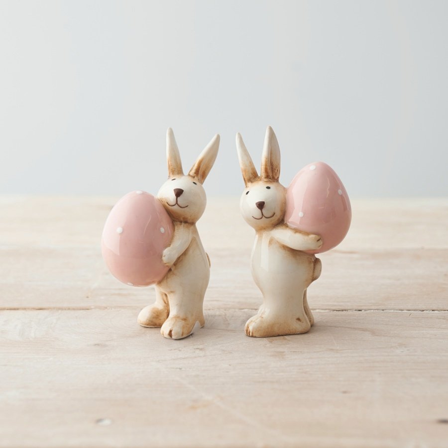 A Charming Assortment of Two Rabbits Carrying Eggs