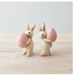 A Charming Assortment of Two Rabbits Carrying Eggs