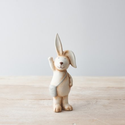 A cute, rustic style bunny ornament with large floppy ears and a grey satchel bag. 