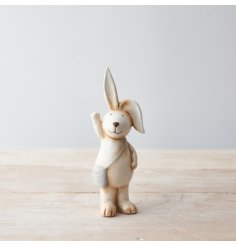 An adorable bunny decoration with cute flopsy ears and a grey satchel. 