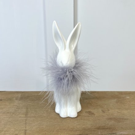 A White Ceramic Rabbit with Grey Feather Collar