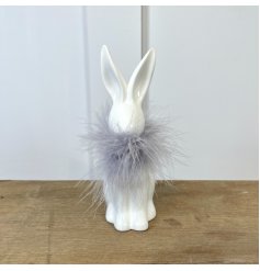 A White Ceramic Rabbit with Grey Feather Collar