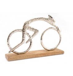 A Stunning Ornament of a Silver Finished Cyclist on Wooden Plinth