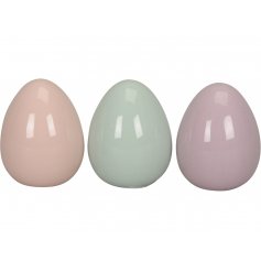 An assortment of 3 pretty pastel coloured decorative eggs