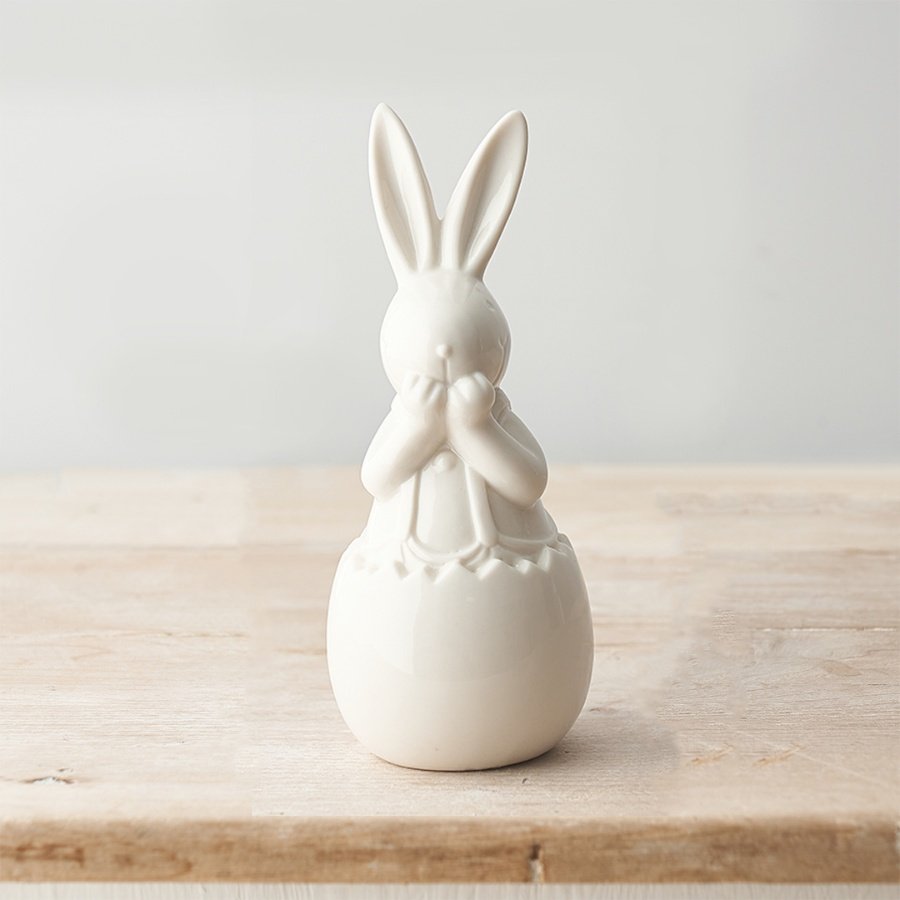 An Adorable White Ceramic Bunny Ornament in an Egg Shell