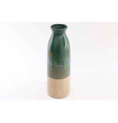 An attractive vase with a crackled glaze finish in ombre green colours.
