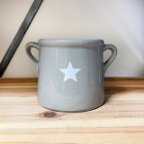 A Festive Grey Pot with White Christmas Star