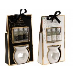 An Assortment of 2 Floral Scented Oil Warmer Set