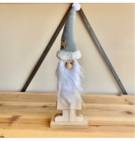 A Wooden Standing Santa with White Fur Trim