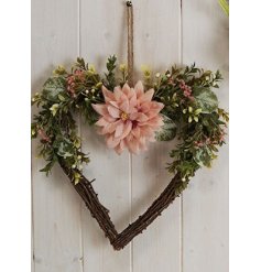 A Pretty Wicker Wreath In A Heart Shape