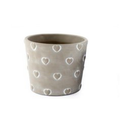 A shabby chic stone planter with a cute heart design. A must have seasonal accessory for the home.