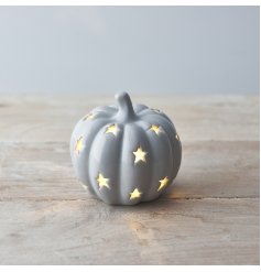 A chic ceramic pumpkin ornament with warm glow LED lights and an attractive grey glaze. 