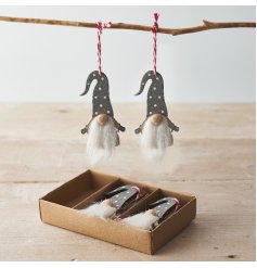 A Set Of Grey And White Wooden Hanging Gonks