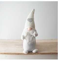 A gorgeous white wonderland gonk with knitted heart hat and an LED twinkling star. 