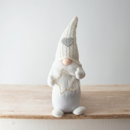 A gorgeous white wonderland gonk with knitted heart hat and an LED twinkling star. 