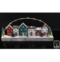 A charming Christmas LED house seen in classic nordic colours. Filled with character and rustic quirks this unique item 