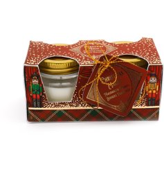 A set of 2 Christmas candle pots with a festive fragrance and nutcracker gift packaging.